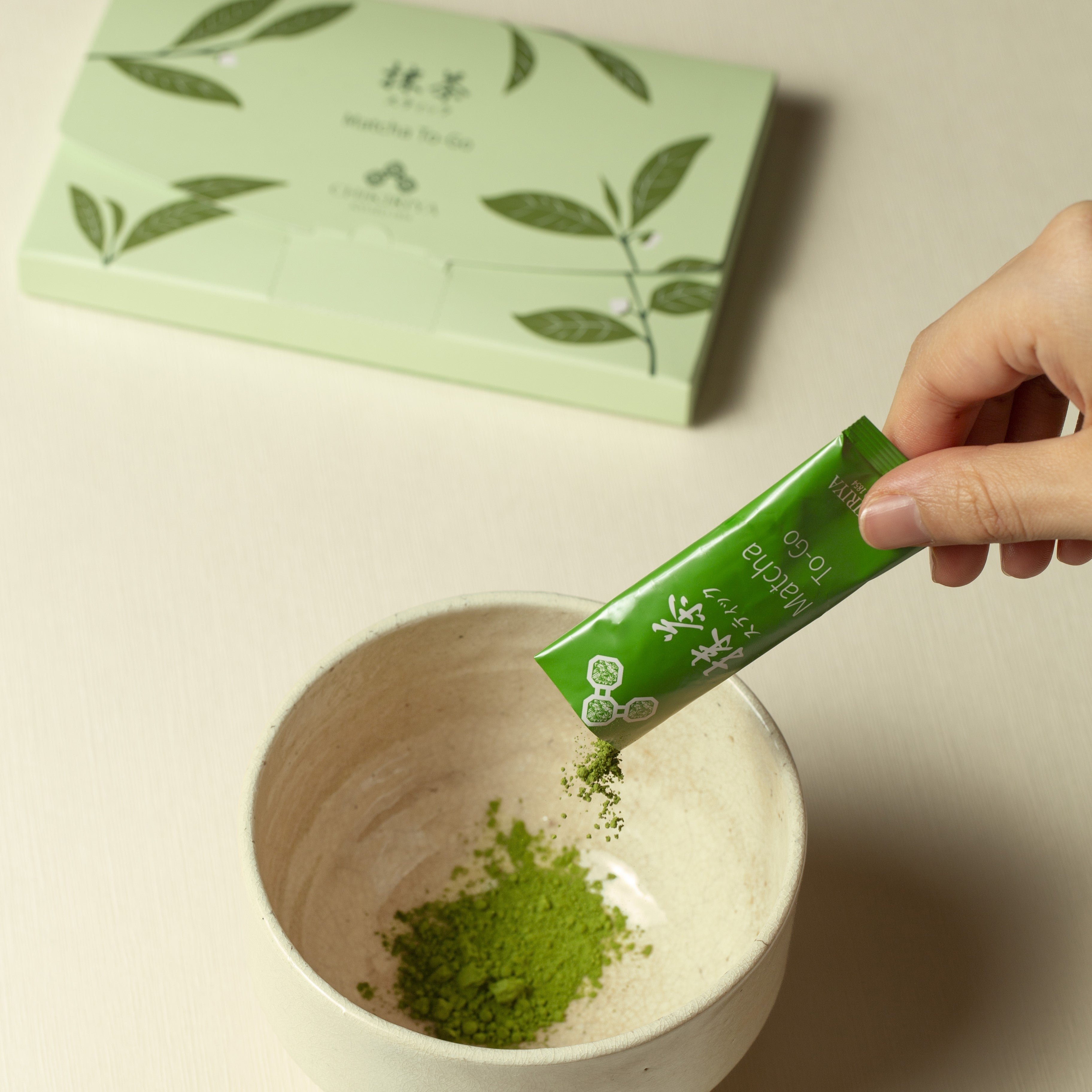 Green matcha sticks with powder and matcha box