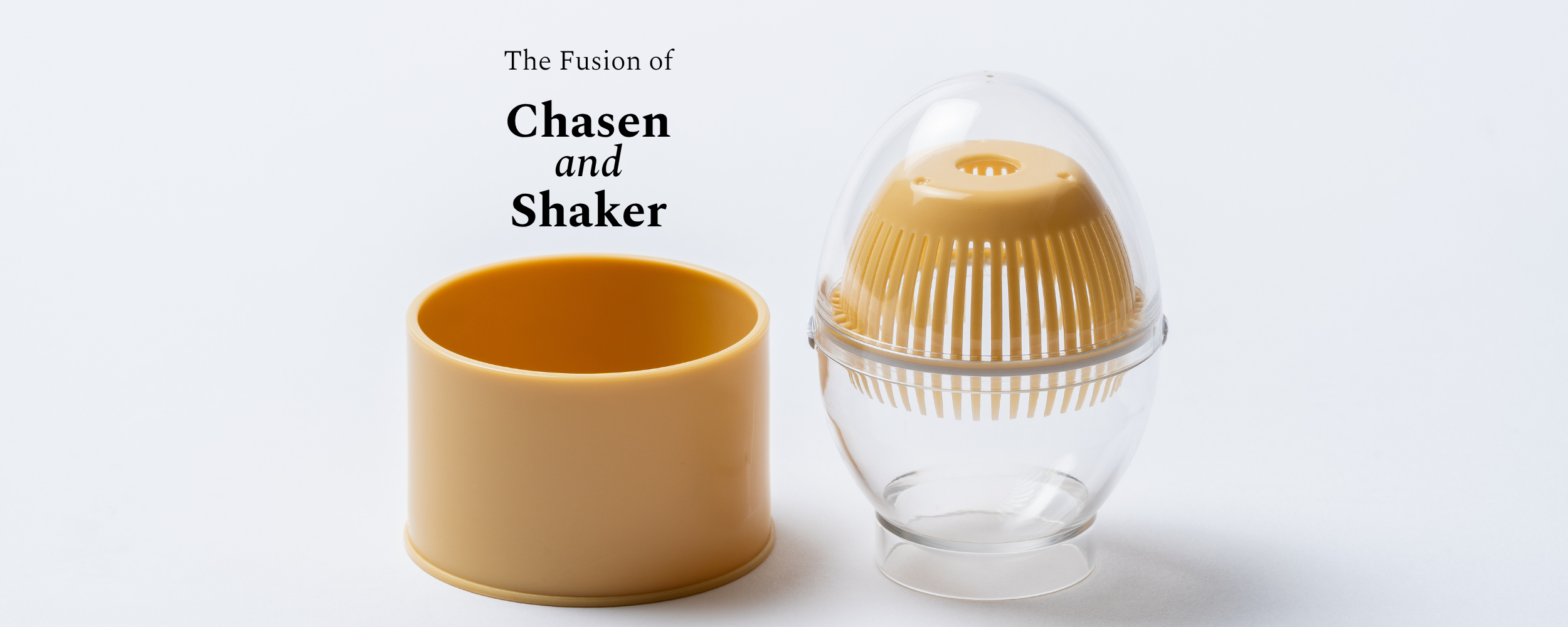 A chasen shaker set shown on a clean white background, featuring a beige ceramic chasen whisk and a clear plastic shaker dome containing a beige whisk head. Text at the top reads 'The Fusion of Chasen and Shaker'.