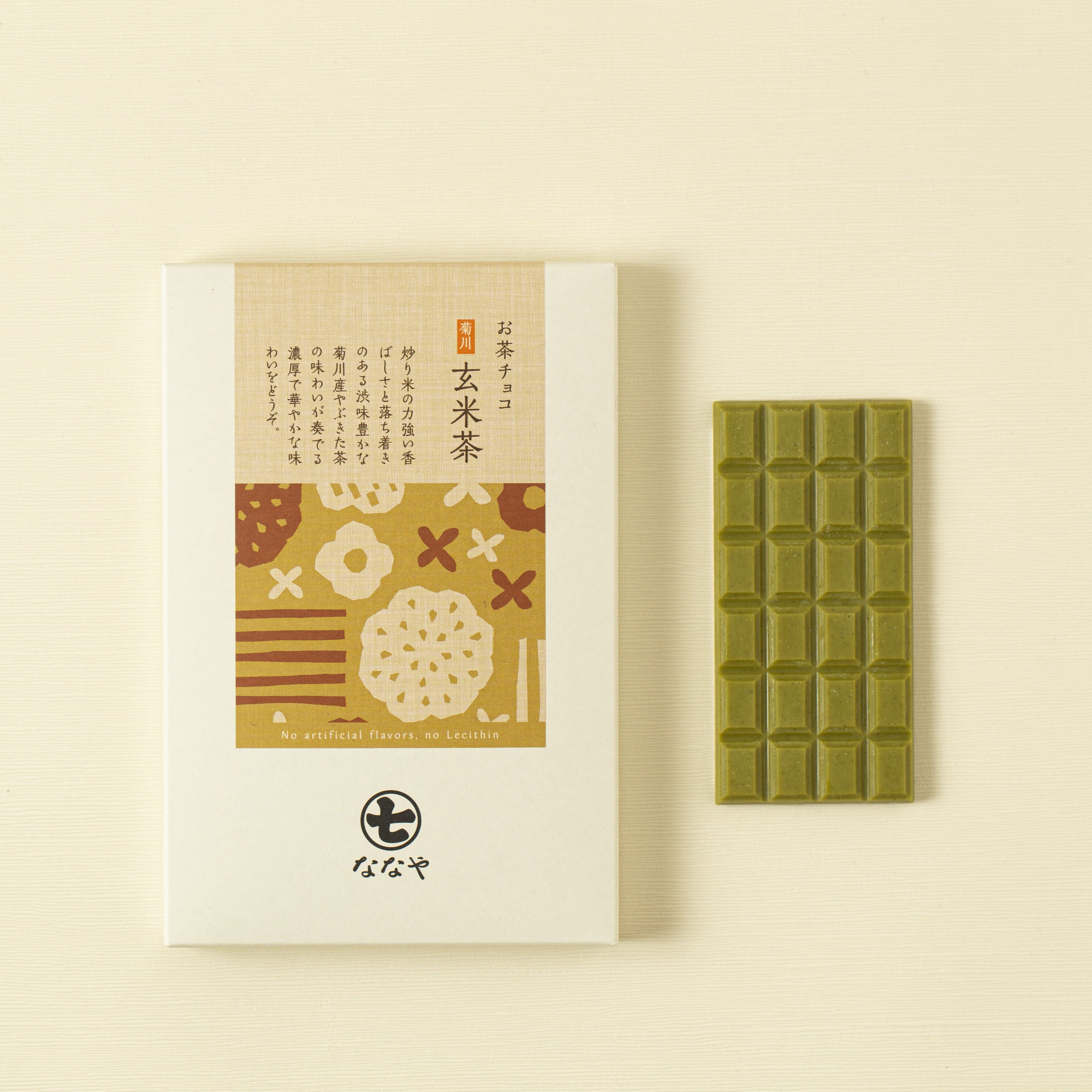 Green tea genmaicha chocolate bar with packaging featuring Japanese text and floral designs on a beige background