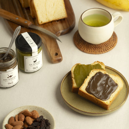 matcha jam and hojicha jam with grilled brioche and a sencha tea along with almonds and raisins