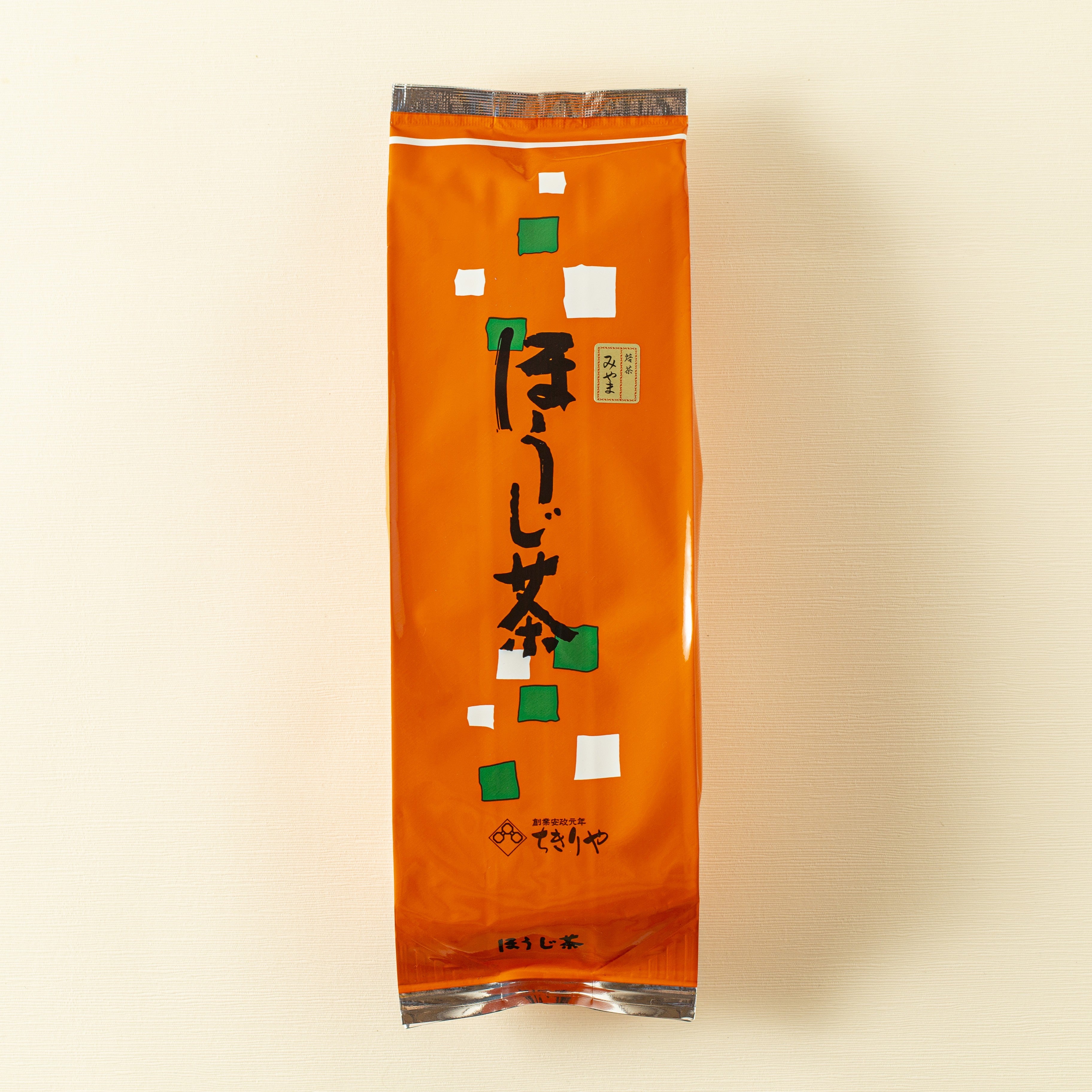 Orange package with Japanese text on a beige background