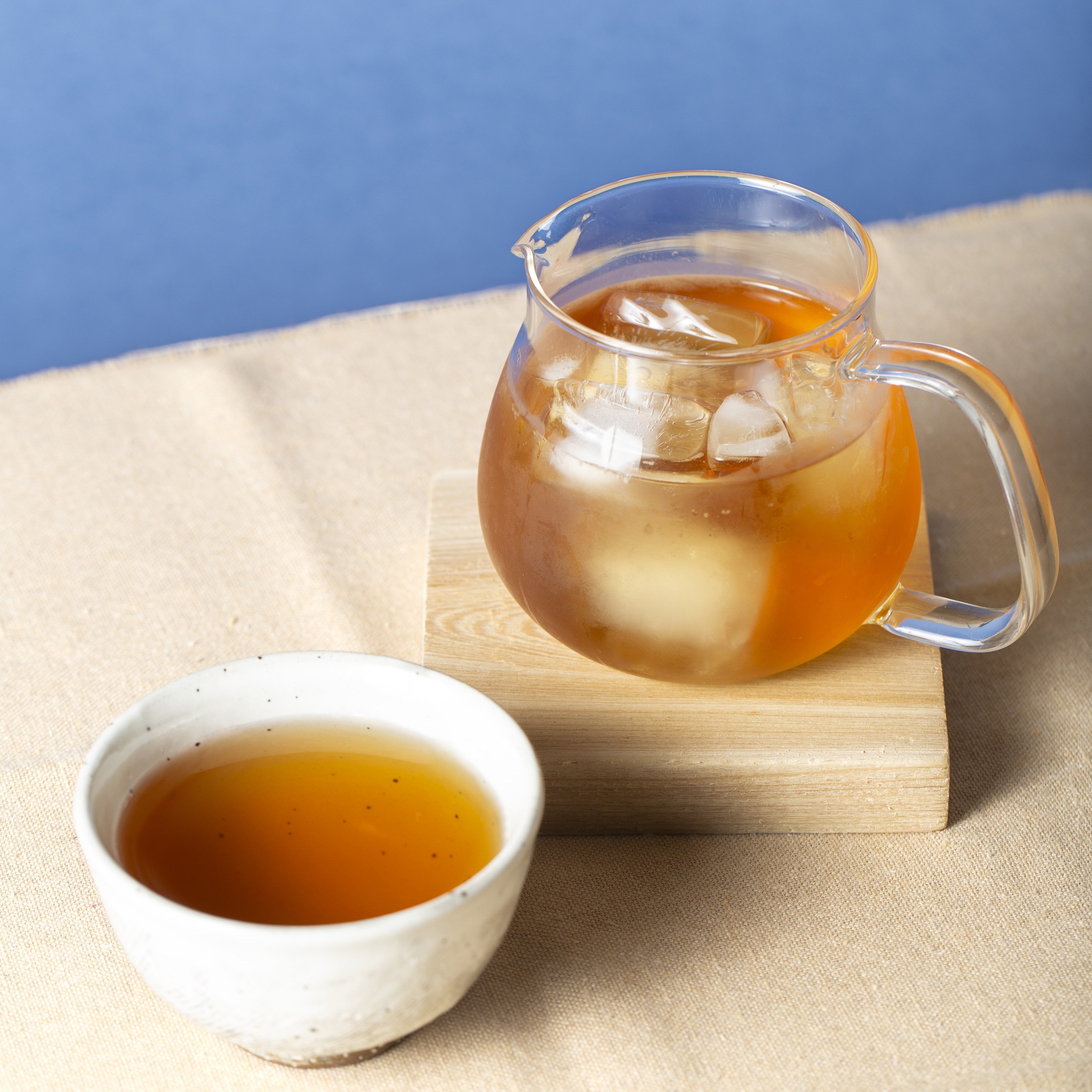 Kyushu Barley Tea within a cup and a teapot with ice cubes