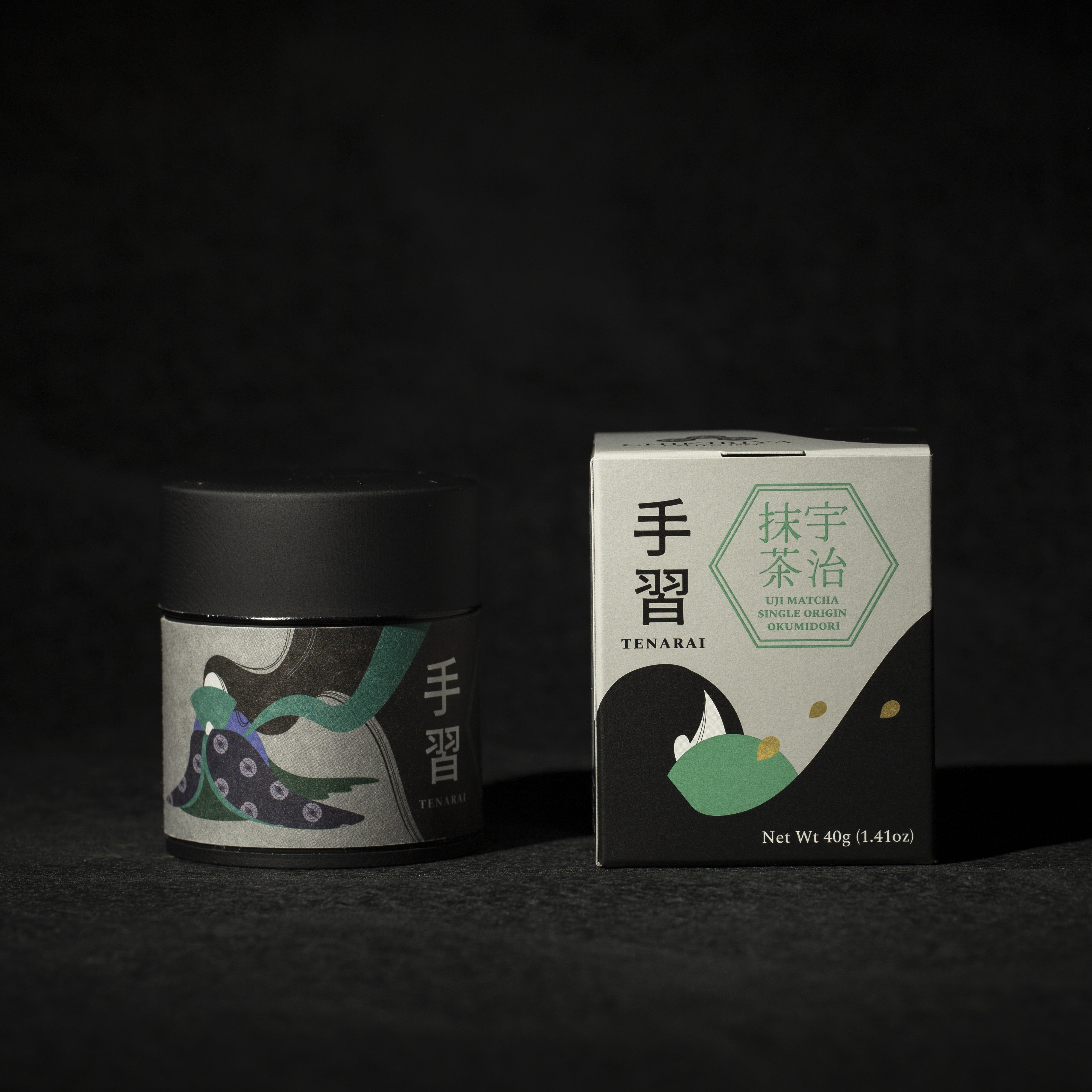 Tea canister and box with decorative elements on a dark background