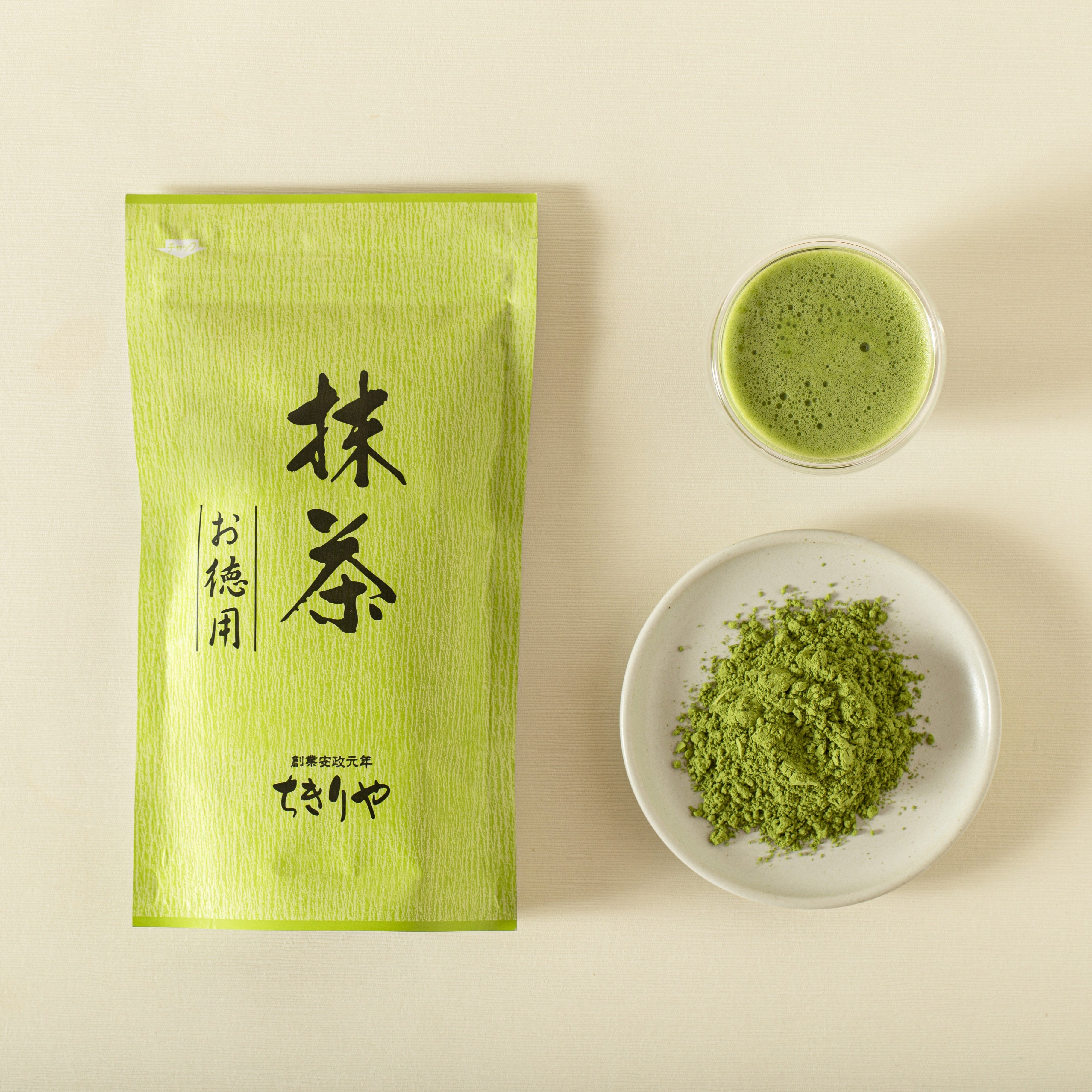Matcha green tea package with a bowl of matcha powder and matcha tea